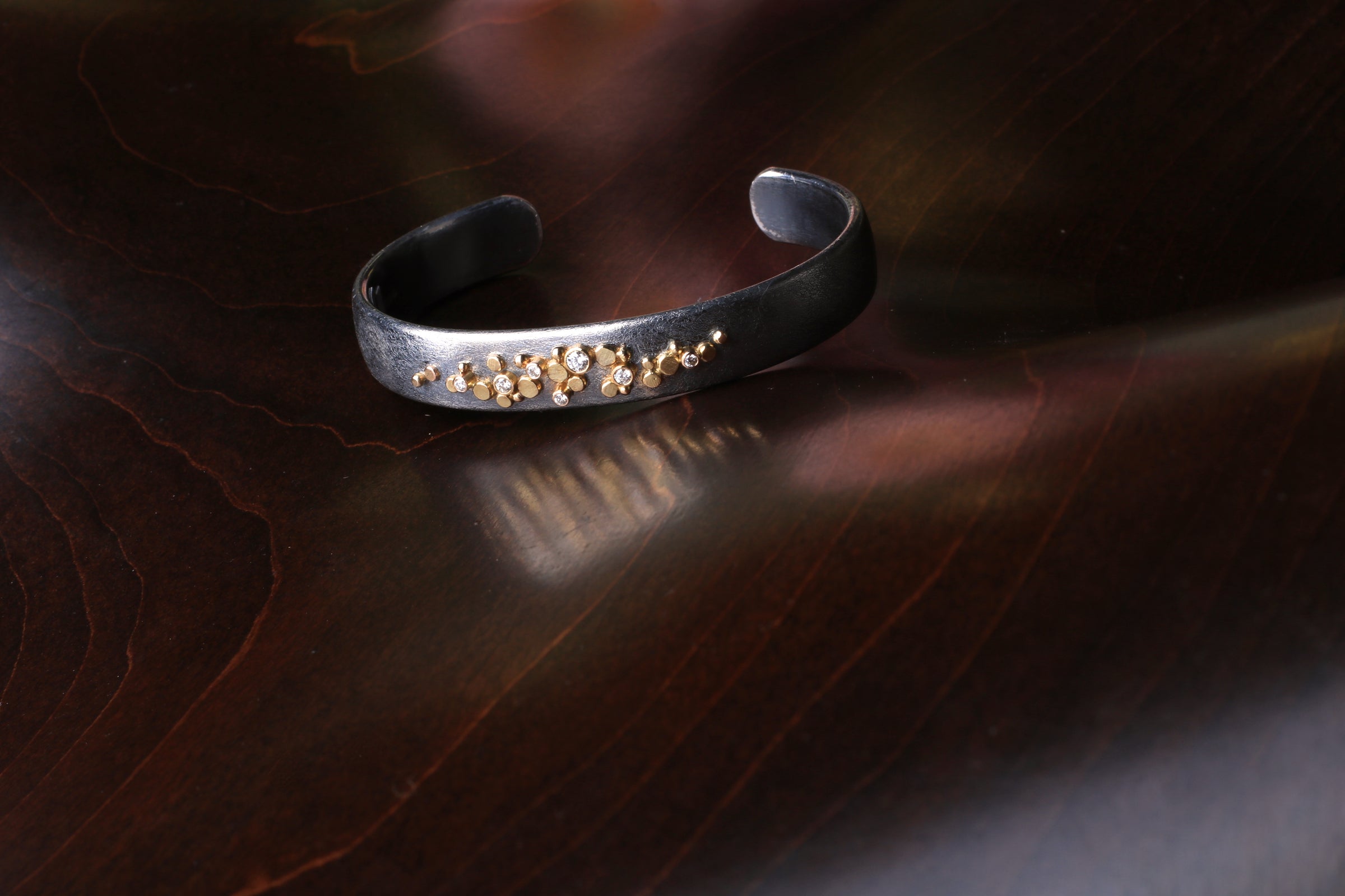sterling silver bracelet oxidized with diamonds and 14K Yellow gold accents